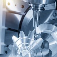 The 5-axis CNC milling machine cutting the metal gear parts with ball endmill tool.The  hi-technology manufacturing process.