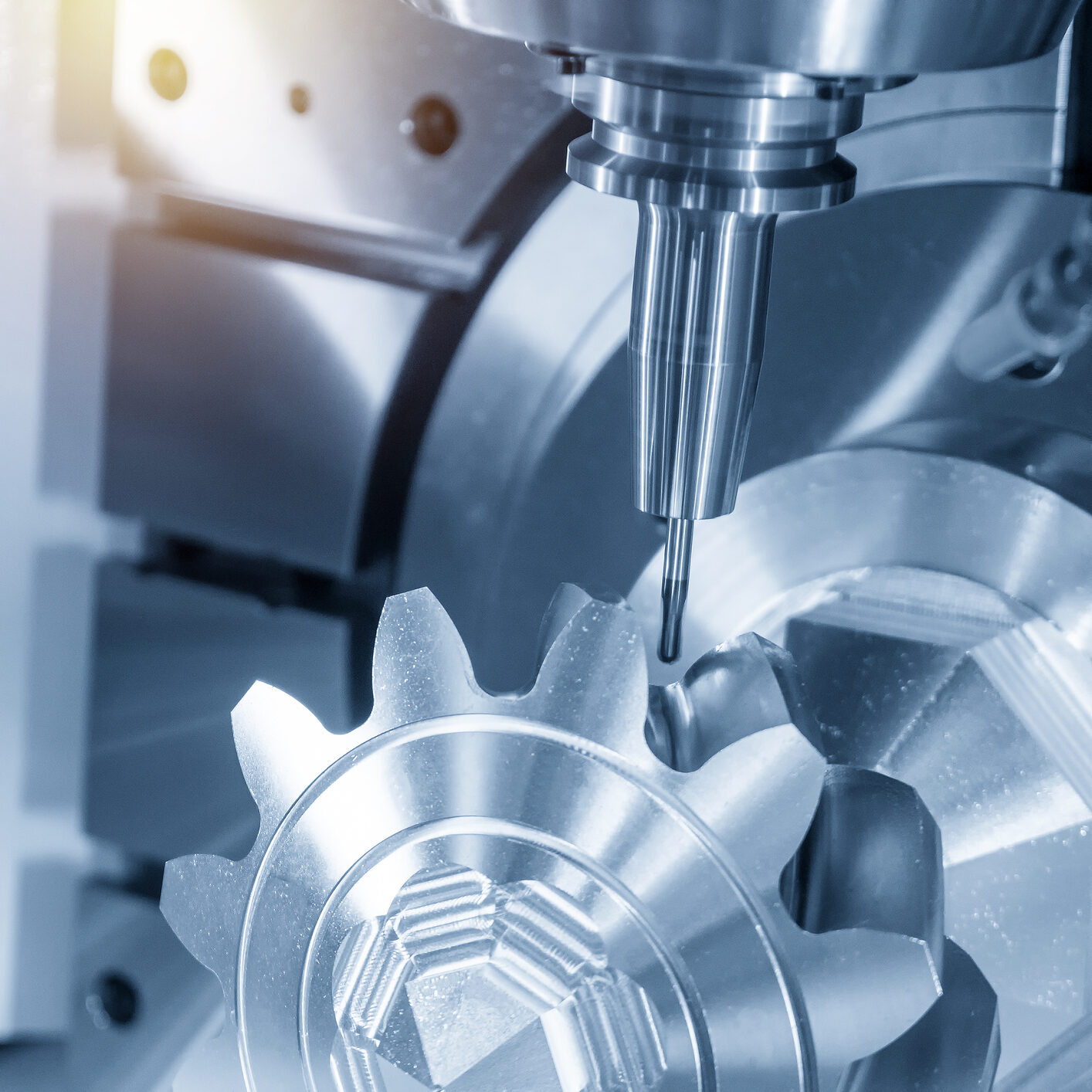 The 5-axis CNC milling machine cutting the metal gear parts with ball endmill tool.The  hi-technology manufacturing process.